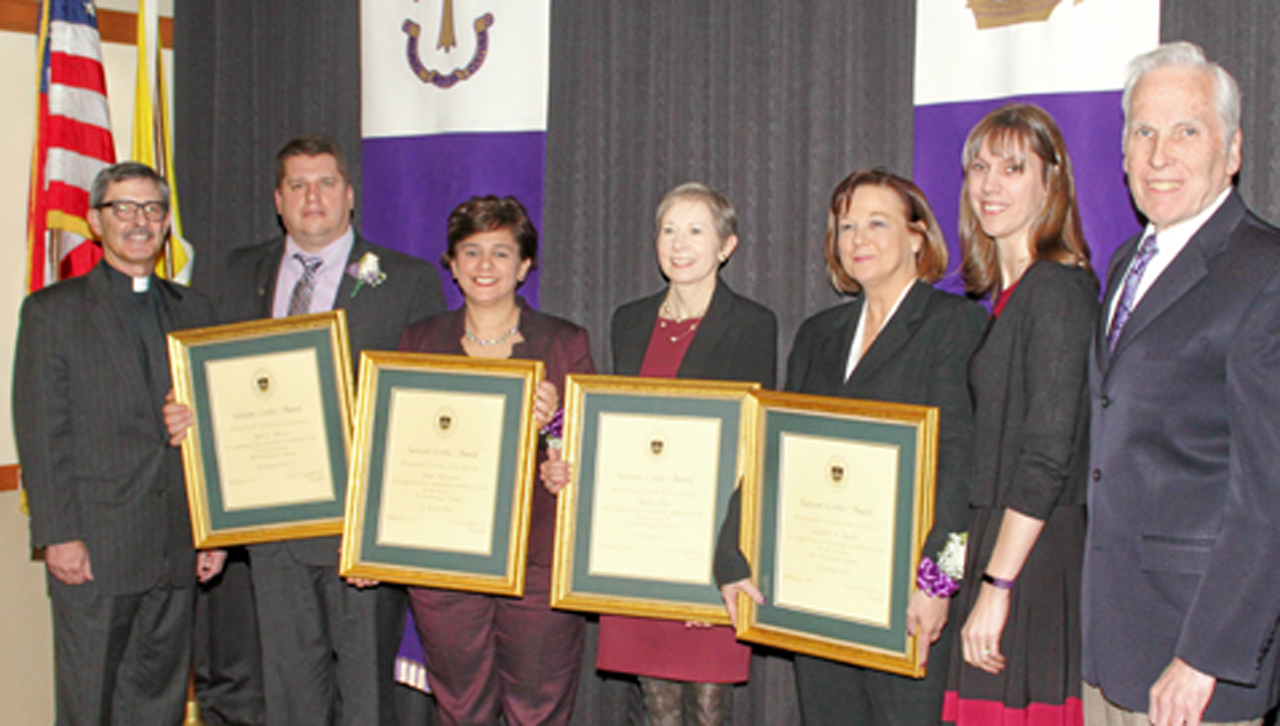 Pictured, from left, are University of Scranton President Kevin P. Quinn, S.J.; Sursum Corda Award recipients: Todd Perry, Frani Mancuso, Pauline Palko and Elizabeth Rozelle; and Patricia Tetreault, associate vice president for human resources; and Joseph Dreisbach, Ph.D., interim provost and senior vice president of academic affairs.