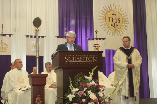 Lawrence R. Lynch ’81, chair of The University of Scranton’s Board of Trustees, formally installs Rev. Herbert B. Keller, S.J. H’06, as Interim President at Scranton at the conclusion of the Mass of the Holy Spirit in the Byron Recreation Complex on campus.