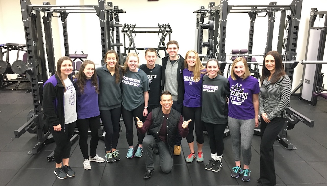 University of Scranton undergraduates majoring in exercise science and sport demonstrated their academic training and knowledge during a series of interviews for WNEP-TV’s Leckey Live morning show on Nov. 8. Front row, center, is WNEP reporter Ryan Leckey. Back row, from left, are: University students Lauren Brogan of Oreland; Megan Shannon of Pompton Lakes, New Jersey; Elizabeth Eichenlaub of Lancaster; Claire Lacon of Blue Bell; Ryan Weathers of Willow Grove; Chris Howarth of Newtown Square; Julianne Burrill of Valley Cottage, New York; Kaitlyn Brogan of Oreland; and Leah Colussi of Nazareth; and Jessica Bachman, Ph.D., assistant professor of exercise science and sport.