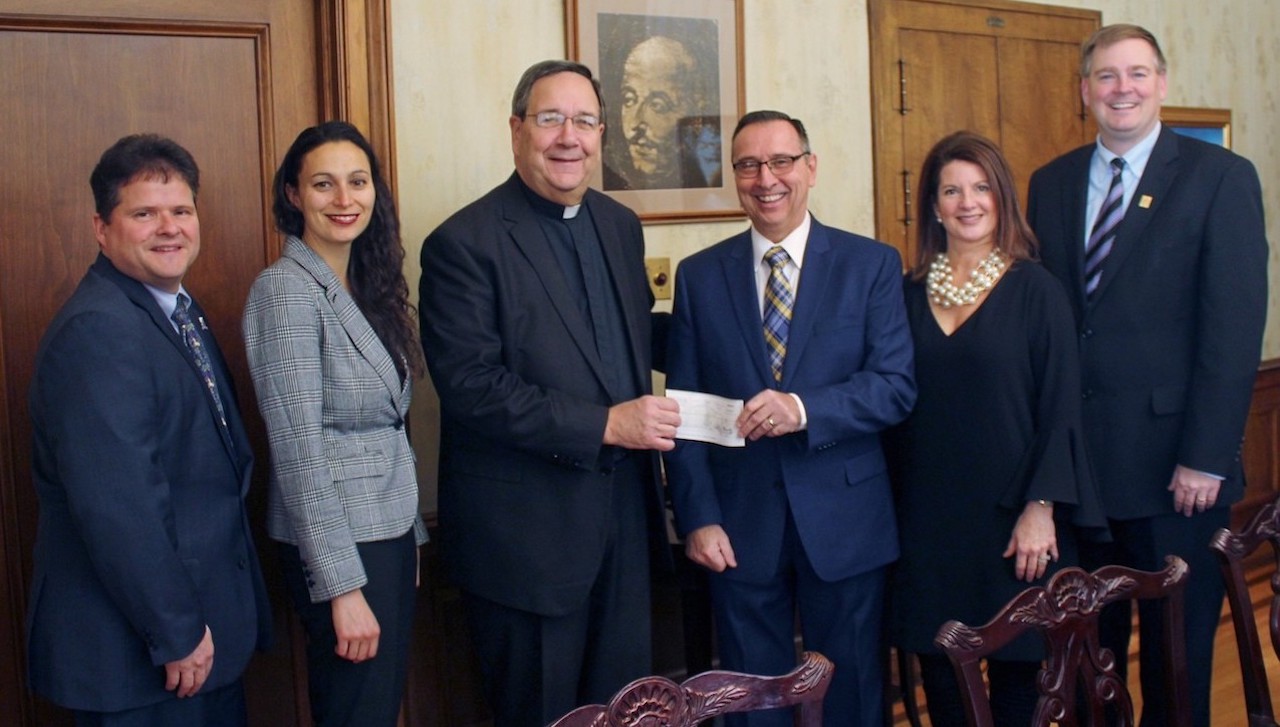 The University of Scranton presented the city of Scranton with its voluntary contribution of $200,000 for 2017, an increase or $25,000 from previous years. The University, in collaboration with city leaders, directed $150,000 of the contribution to support economic development initiatives targeting downtown Scranton. From left: representing the University are Gerry Zaboski, vice provost, enrollment management and external affairs; Julie Schumacher Cohen, director of community and government relation; and Rev. Herbert B. Keller, S.J., interim president; Bill Courtright, mayor, City of Scranton; Leslie Collins, executive director, Scranton Tomorrow; and Ken Okrepkie, board president, Scranton Tomorrow.