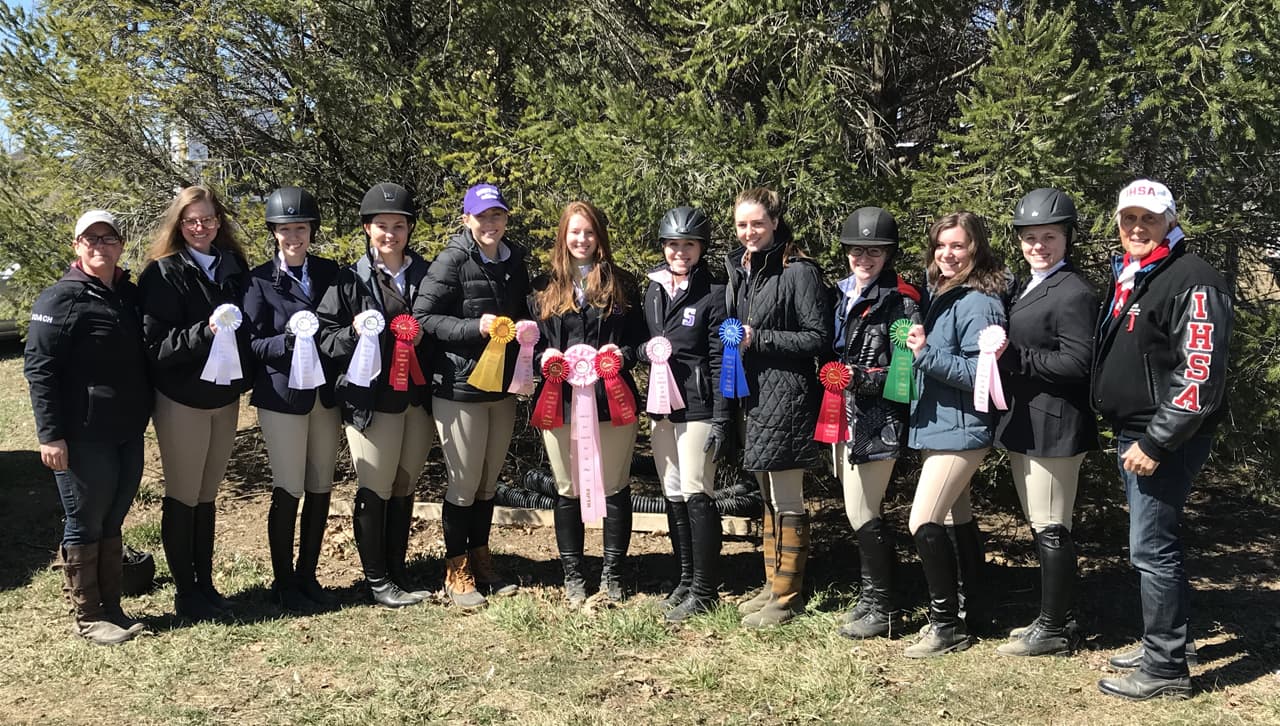 The team smiles with their ribbons after their March 18 show with IHSA founder, Bob Cacchione.