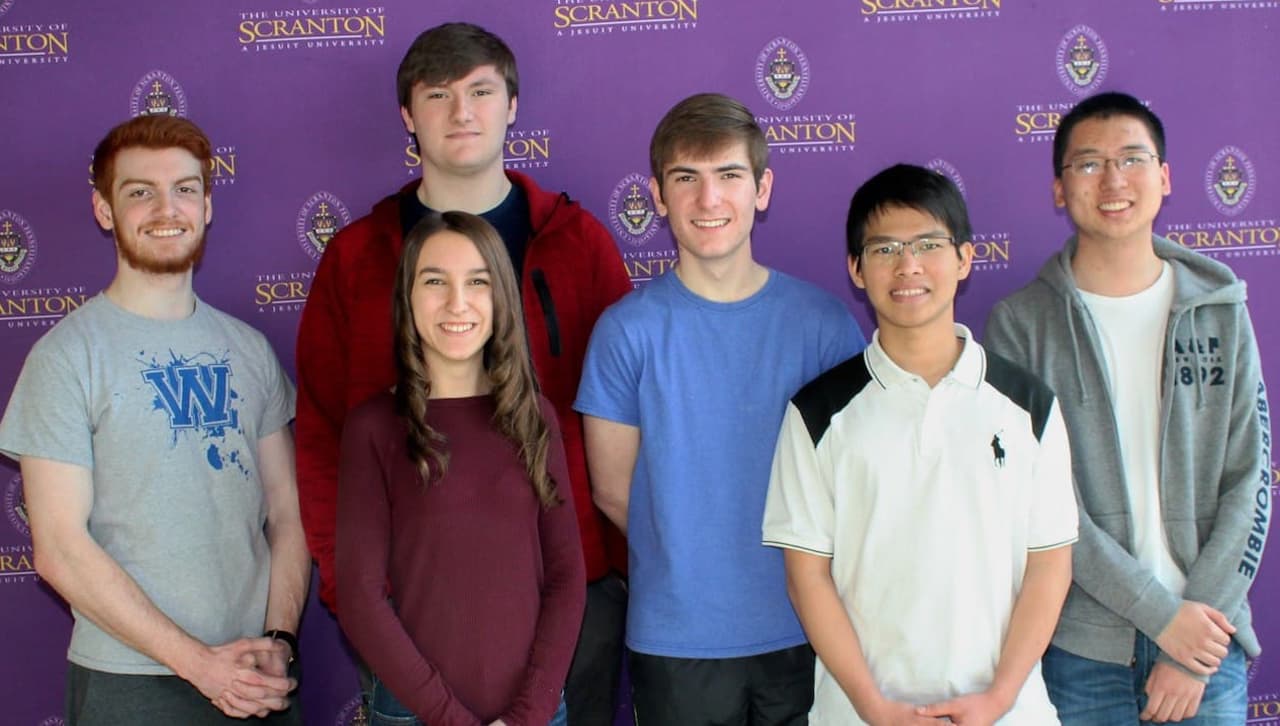 COMMUNITY placeholder HIGH SCHOOL STUDENTS COMPETE IN PROGRAMMING CON... Teams from Scranton Preparatory School came in first place and third place at The University of Scranton’s annual Computer Programming Contest. From left: Sean McTiernan, Scranton, a sophomore at The University of Scranton majoring in computer science; and members of the Scranton Preparatory student team 1 that won the competition Kailey Bridgeman (front), Colin Pierce and Charles Kulick; and Scranton Preparatory students in team 2 that placed third in the competition Cuong Nguyen and Ryan Chan. Patrick Clemens, director of technology at Scranton Preparatory School and the coach of both teams, was absent from the photo.