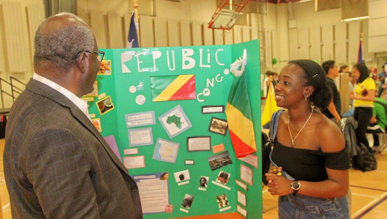 Kania School of Management Dean Michael Mensah, Ph.D., left, speaks to University student Audrey Nlandou, who is representing the Republic of Congo at the University’s Festival of Nation.