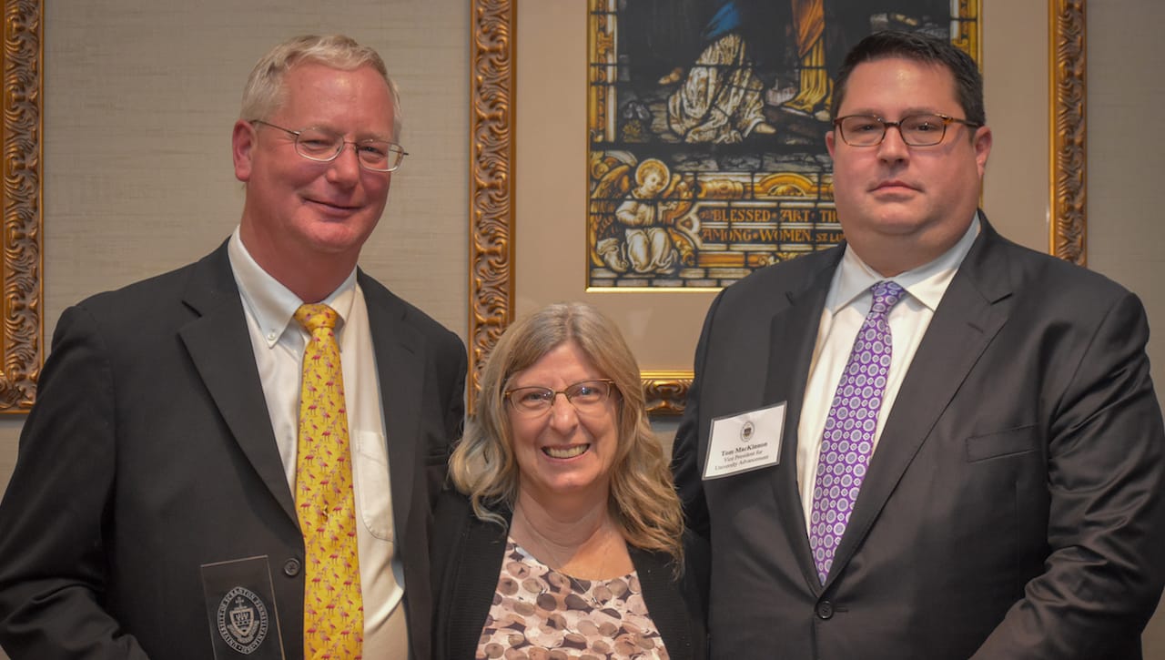 The University of Scranton recognized A.J. Guzzi General Contractors, Inc., as its 2018 Business Partner of the Year. Pictured at the 13th annual Business Partner Appreciation Dinner, from left, are: John and Carol Heim, owners of AJ Guzzi General Contractors, and Thomas MacKinnon, vice president for University advancement.