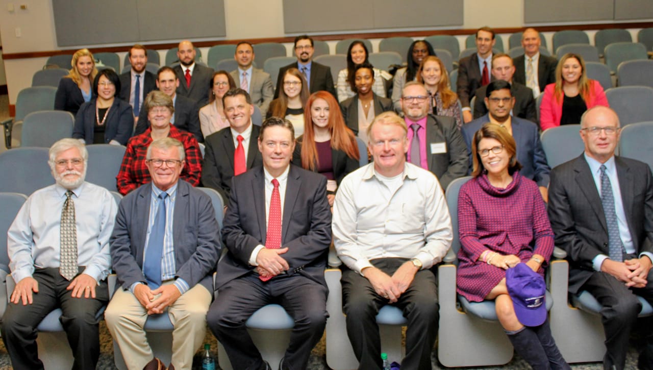 The University of Scranton welcomed to campus the second cohort of students enrolled in the doctor of business administration (DBA) program. First row, from left: DBA faculty Robert Spalletta, Ph.D., professor of physics/electrical engineering; Daniel West, Ph.D., professor and chair of the Health Administration and Human Resources Department; and Douglas M. Boyle, D.B.A., associate professor, chair of the Accounting Department and DBA program director; and University Trustees Christopher Kane, Tracy Bannon and Frank Dubas. Second row: DBA faculty Rebecca Mikesell, Ph.D., assistant professor of communication, and James Boyle, Ph.D., assistant professor of accounting; and DBA students Ashley L. Stampone of Old Forge; Ronald Parker of Franklin, North Carolina; and Joy Chacko of Chandler, Arizona. Third row: DBA students Ran Li of Potsdam, New York; Daniel Gaydon of Plains; Heather Losi of Liverpool, New York; Jessica L. Hildebrand of Mountain Top; Shea N. Burden of Athens, Ohio; Linette Rayeski of West New York, New Jersey; James W. Sunday of Scranton; and Alexis C. Montelone of Bensalem. Fourth row: DBA students Amanda Marcy of Clifford Township; Patrick O’Brien of North Merrick, New York; Craig Gallagher of South Abington Township; Savas Saymaz of Whitehall; Marcus Burke of Poughkeepsie, New York; Felisha N. Fret of Great Neck, New York; Afia A. Oppong of New City, New York; Hugh Lambert of Rochester, New York; and Charles Speicher of North Attleboro, Massachusetts.