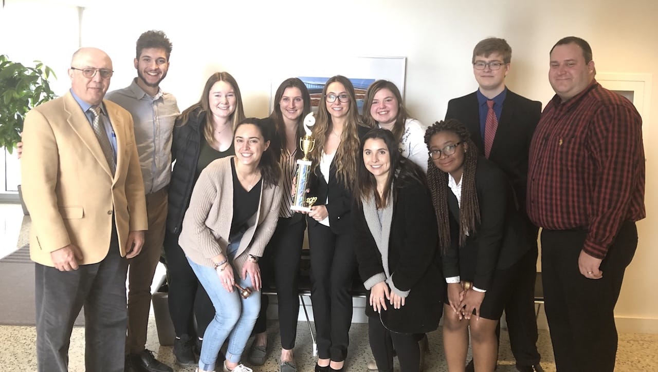 The University of Scranton’s mock trial team will compete in the opening round American Mock Trial Association’s national tournament in Central Islip, New York, on March 9 and 10. Front row, from left, are team members Megan Bertrand, Veronica Sansone and Leticia Demps. Back row are team coach, Sidney Prejean, Esq.; team members Nicholas Velez; Margaret Westerman; co-captains Kimberly Shaw and Alexis Mergus; Zoe Rodriguez; Ryan Paolilli; and faculty advisor Jason Shrive, Esq., assistant professor in the sociology, criminal justice and criminology department.