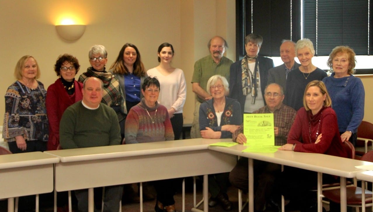 Committee members met to plan The University of Scranton’s Weinberg Memorial Library annual Book, Plant and Tag Sale, scheduled for Saturday and Sunday, April 27 and 28, in the Scranton Heritage Room on the fifth floor of the library.Seated, from left, Kevin Kocur, interlibrary loan coordinator; Geri Botyrius; Phyllis Reinhardt, co-chair; Michael Knies, co-chair and special collections librarian; and Kym Fetsko, administrative assistant for the library. Standing are Barbara Evans, circulation/access service clerk for the library; Marian Shambe; Annmarie Fetsko; Rosemary Shaver; Camille Reinecke; Peter Tafuri; Jean Lenville, associate dean of the library; Charles E. Kratz, dean of the library and information fluency; Carolyn Santiso; and Kathy Belak. 