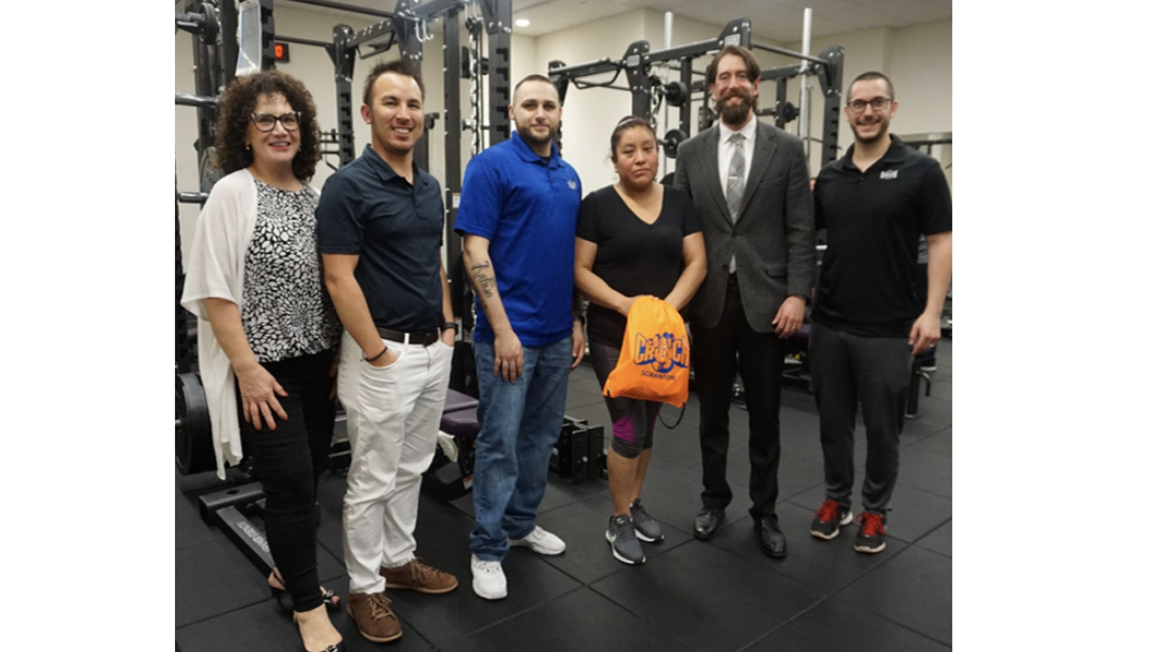 From left: Andrea Mantione, director, Leahy Community Health and Family Center; Bryon Applequest, assistant professor, exercise science and sport; Richie Artuso, CRUNCH Fitness; Mayra Monge (winner of the membership); Andrew Venezia, assistant professor, exercise science and sport; Brad Reiss, CRUNCH Fitness)