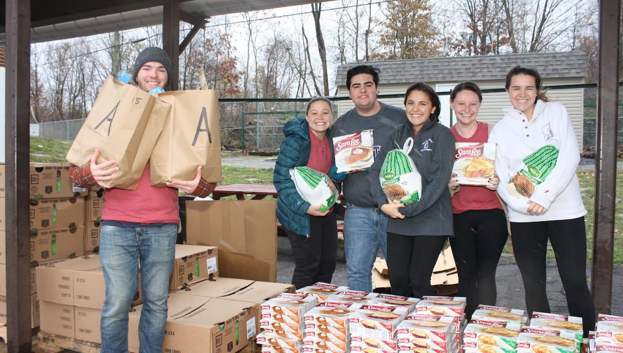 Among the University of Scranton students preparing 200 Thanksgiving food baskets for area families in need are, from left: John Garvey, a history major from Marlton, New Jersey; Kaitlyn, Franceschelli, an undeclared major from Spring Brook Township; Marino Angeloni, a counseling and human services major from Jessup; Avianna Carilli, a physiology major from Scott Township; Sarah Brown, an occupational therapy major from Scranton; and Maeve Seymour a nursing major from Clarks Summit.