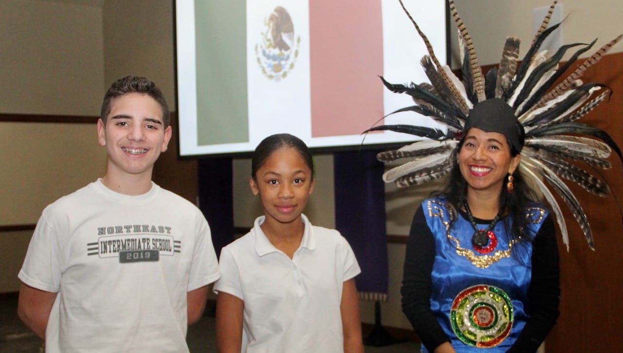 University of Scranton Fulbright Teaching Assistant Vianey Florentino Perez discussed Mexico with elementary and middle school students from Northeast Intermediate School and The Lutheran Academy as part of the University’s International Education Week programming. From left are: Chris Delsantro and Tenaya Jones, both in the sixth grade at Northeast Intermediate School, and Vianey Florentino Perez.