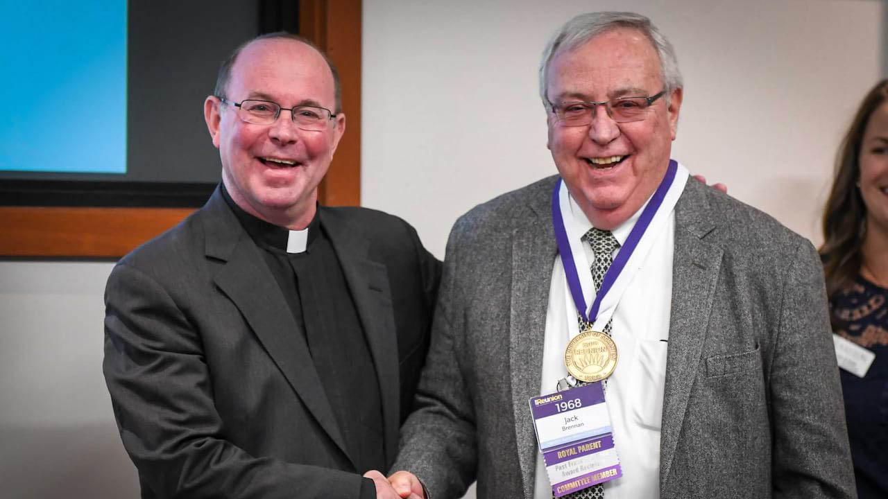 Rev. Scott R. Pilarz, S.J., University President, presents John (Jack) Brennan '68, P'06 with a 50-Year Reunion Medal at Reunion Weekend 2018.