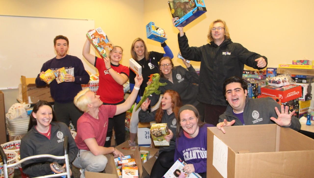 Pictured are University of Scranton students from the 2019 Christmas gift drives. The University’s Center for Service and Social Justice modified their annual Christmas giving programs this year to comply with COVID-19 health restrictions.