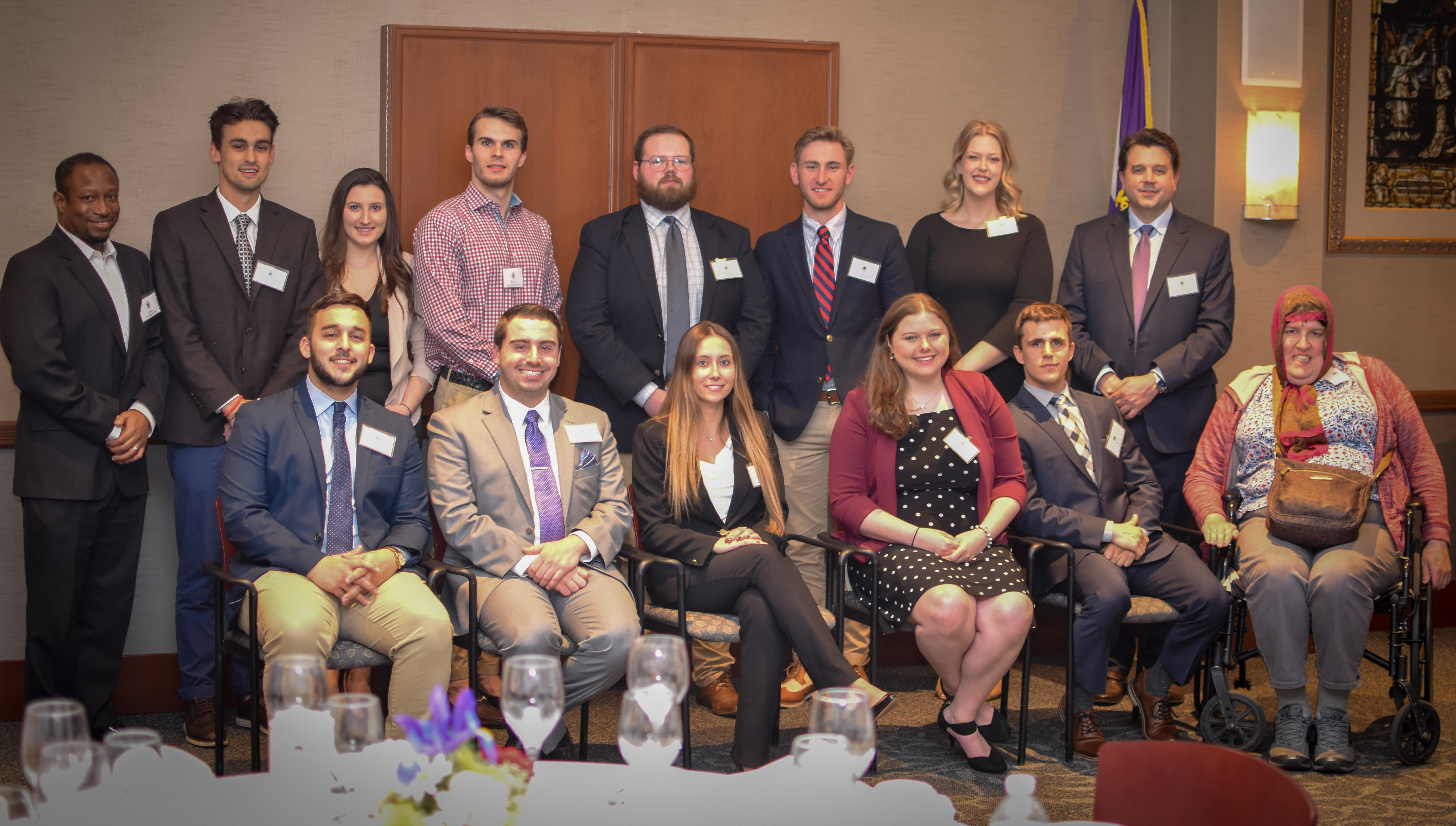 Members of the class of 2019 pose with members of the faculty at the Pre-law Advisory Program Banquet in 2019. 