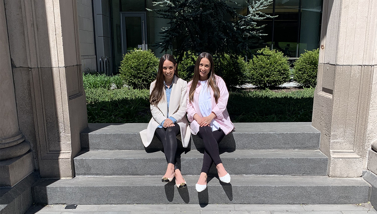 Twins Mary Lynn Massino G’20 (left) and Maria Ehnot G’15 (right) in front of Leahy Hall at Scranton.