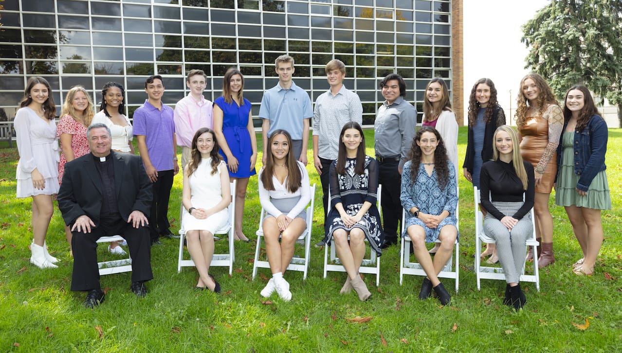 Eighteen students from The University of Scranton’s class of 2025 have been awarded four-year, full-tuition Presidential Scholarships. Seated from left are: Rev. Joseph Marina, S.J., president of The University of Scranton; and Presidential Scholars Elizabeth McKechney, Theresa Pham, Grace Boyle, Samantha Hoffmann and Amanda Campbell. Standing are Presidential Scholars Cabre Capalongo, Grace Washney, Arissa Chambers, Anthony Torres, Liam Moran, Grace McDonald, Patrick DelBalso, Stephen Butler, Nicolas Hipolito Jr., Alexandra Shomali, Mary Krichbaum, Gabrielle Bingener and Bella Davis.