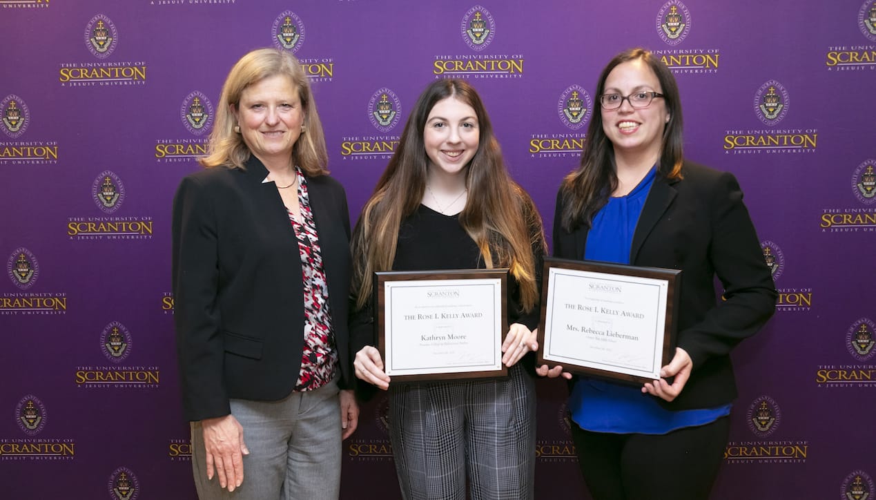 University students and their high school teachers who they credit for contributing to their success were honored with Rose Kelly Awards at a recent ceremony held on campus. From left: Victoria Castellanos, Ph.D., dean of the Panuska College of Professional Studies, and Rose Kelly Award recipients Kathryn Moore and her guidance counselor from Oyster Bay High School, Rebecca Lieberman.