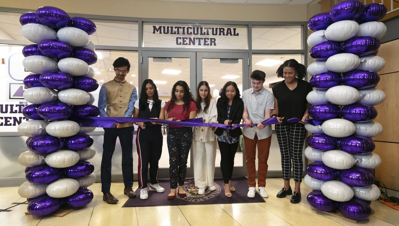 University of Scranton students cut the ribbon at the Grand Opening and Blessing Ceremony of the newly expanded and renovated Multicultural Center, now prominently located on the first floor of the DeNaples Center. From left are: Siddharth Patel, Danica Sinson, Ashley Moronta, Arielle Contrera, Erica Mascardo, Eli Kerr and Ayana McCalla.