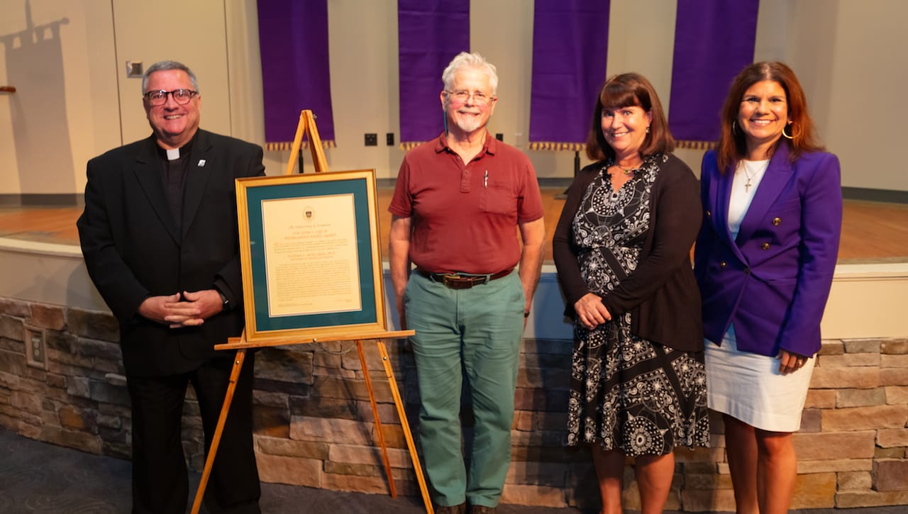 Stephen E. Whittaker, Ph.D., professor of English and theatre at The University of Scranton, received the 2023 John L. Earl III Award for service to the University, the faculty and the wider community. From left are: Joseph Marina, S.J., president; Dr. Whittaker, John L. Earl III Award recipient; Karen Earl Kolon, M.D. ’85, daughter of the late John Earl; and Michelle Maldonado, Ph.D., provost and senior vice president for academic affairs.