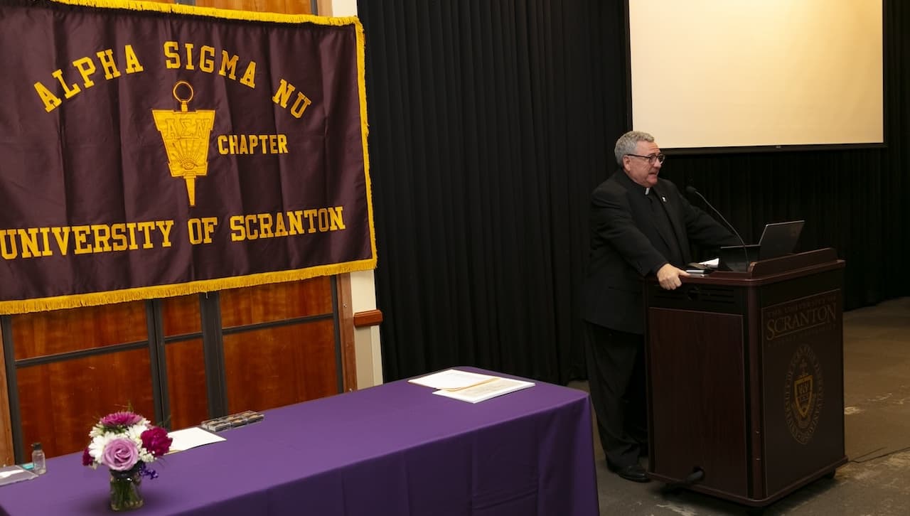 University of Scranton President Rev. Joseph Marina, S.J., speaks at the Alpha Sigma Nu Honor Society Induction Ceremony. Seventy-five University of Scranton junior, senior and graduate students were inducted into the national honor society for students in Jesuit colleges and universities.