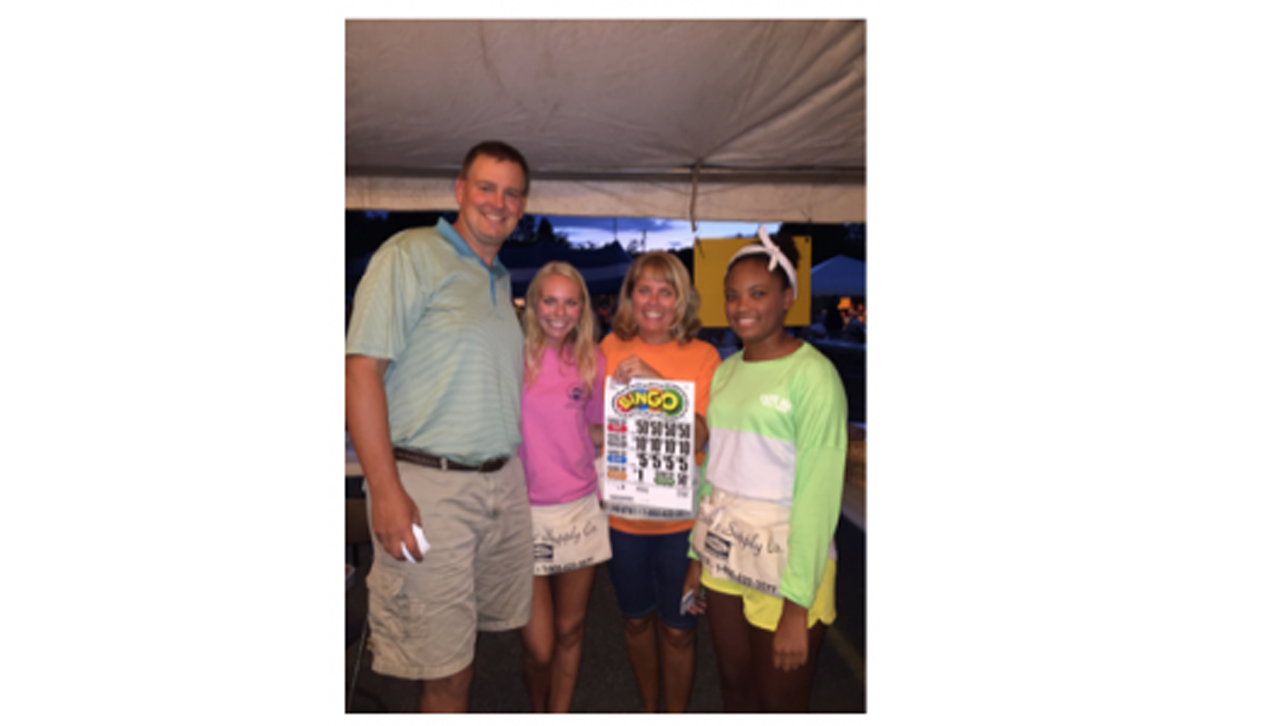 A Pavlick-Okrepkie family tradition is staffing the instant bingo booth at the Our Lady of the Snows/Church of St. Benedict’s Country bazaar every summer. Left to right: Ken Okrepkie, Emily Okrepkie, Kim Pavlick and Grace Okrepkie.