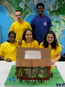 The team placing first in the University of Success solar home building competition, seated from left, are: Sajada Gary and Anna Torres, both of Scranton, and Kayla Martinez, Kingston. Standing, from left, are: Kenneth Kasmarcik, Scranton, and Malik McDonald, Plains. 