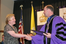 Rev. Scott R. Pilarz, S.J., president of The University of Scranton (right), congratulates Marlene J. Morgan, Ed.D., assistant professor of occupational therapy, in being selected as Teacher of the Year by Scranton’s Class of 2010.