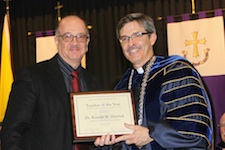 University of Scranton President Kevin P. Quinn, S.J., (right) congratulates Ronald W. Deitrick, Ph.D., associate professor and director of the exercise science program, who was named Teacher of the Year by the University’s class of 2013.
