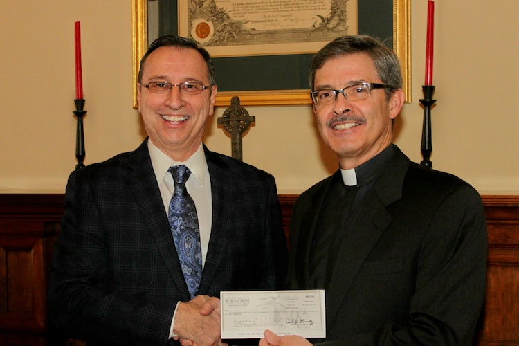 The University of Scranton presented the city of Scranton with its annual voluntary contribution of $175,000 for 2014. The University’s voluntary contributions total more than $3.1 million since 1983. The voluntary contribution is in addition to the numerous other ways the University positively impacts the community and economy. Standing, from left, are: Scranton Mayor Bill Courtright and University of Scranton President Kevin P. Quinn, S.J. 