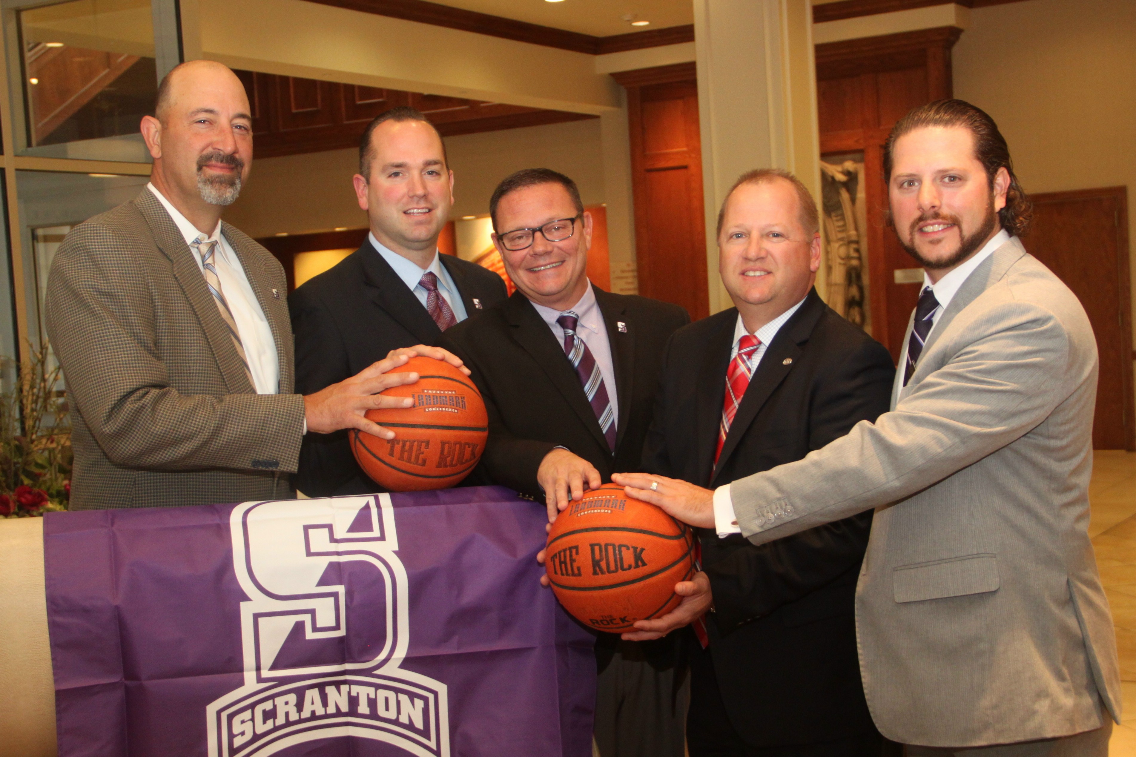The Hilton Scranton and Conference Center is the lead sponsor of University of Scranton’s Athletics for the 2015-16 season, which includes the Hilton Scranton Invitational on Nov. 13 and 14 and the Hilton Poinsettia Classic on Dec. 15 and 16. From left, representing The University of Scranton, are: Carl Danzig, men’s head basketball coach; Trevor Woodruff, Lady Royals head basketball coach, and Dave Martin, director of athletics; and, representing Hilton Scranton and Conference Center, are John Argonish, general manager, and Ryan Alpert, director of sales and marketing.