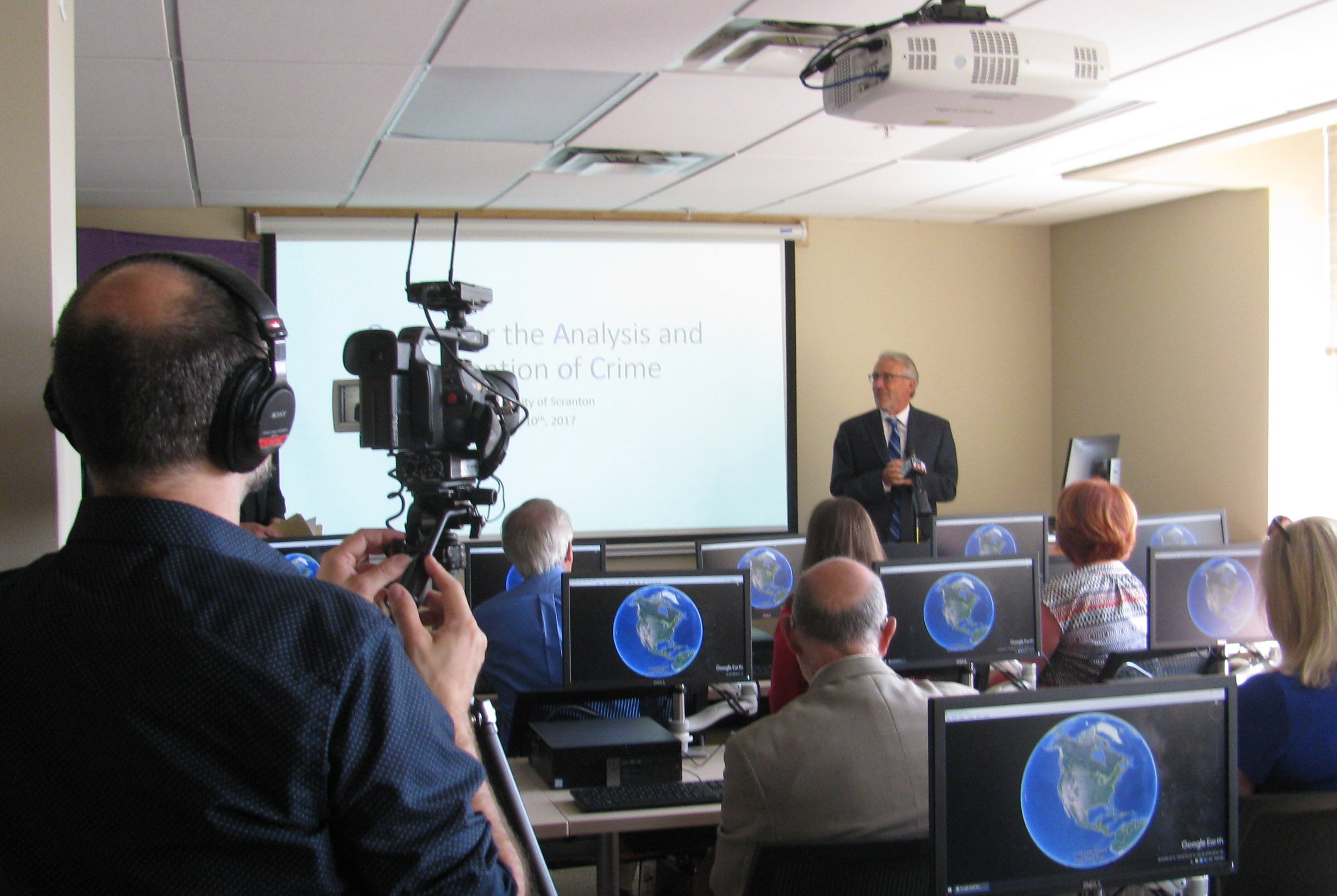 Brian Conniff, Ph.D., dean of the College of Arts and Sciences at The University of Scranton, welcomes guests attending the preview of the University’s new Center for the Analysis and Prevention of Crime. The center will serve as an academic lab for criminal justice students to engage with faculty and community members using cutting edge technology and sophisticated analytical programs.