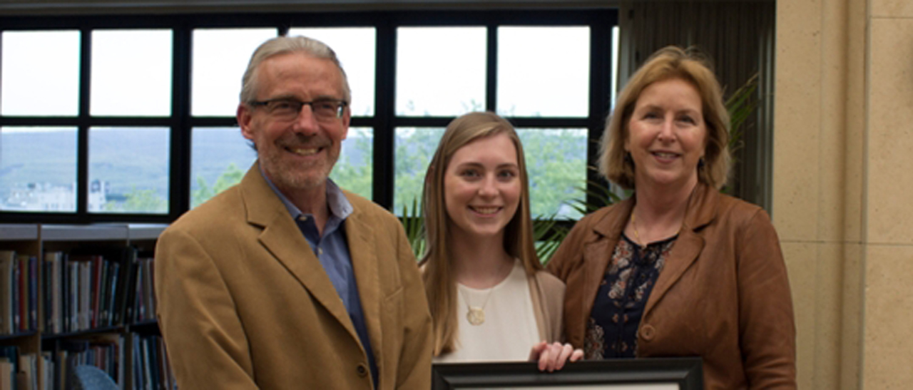 From left: Brian Conniff, Ph.D., dean of the College of Arts and Sciences; Kathleen Reilly, recipient of the 2017 Library Research Prize in the undergraduate student category; and Susan Poulson, Ph.D., professor of history.