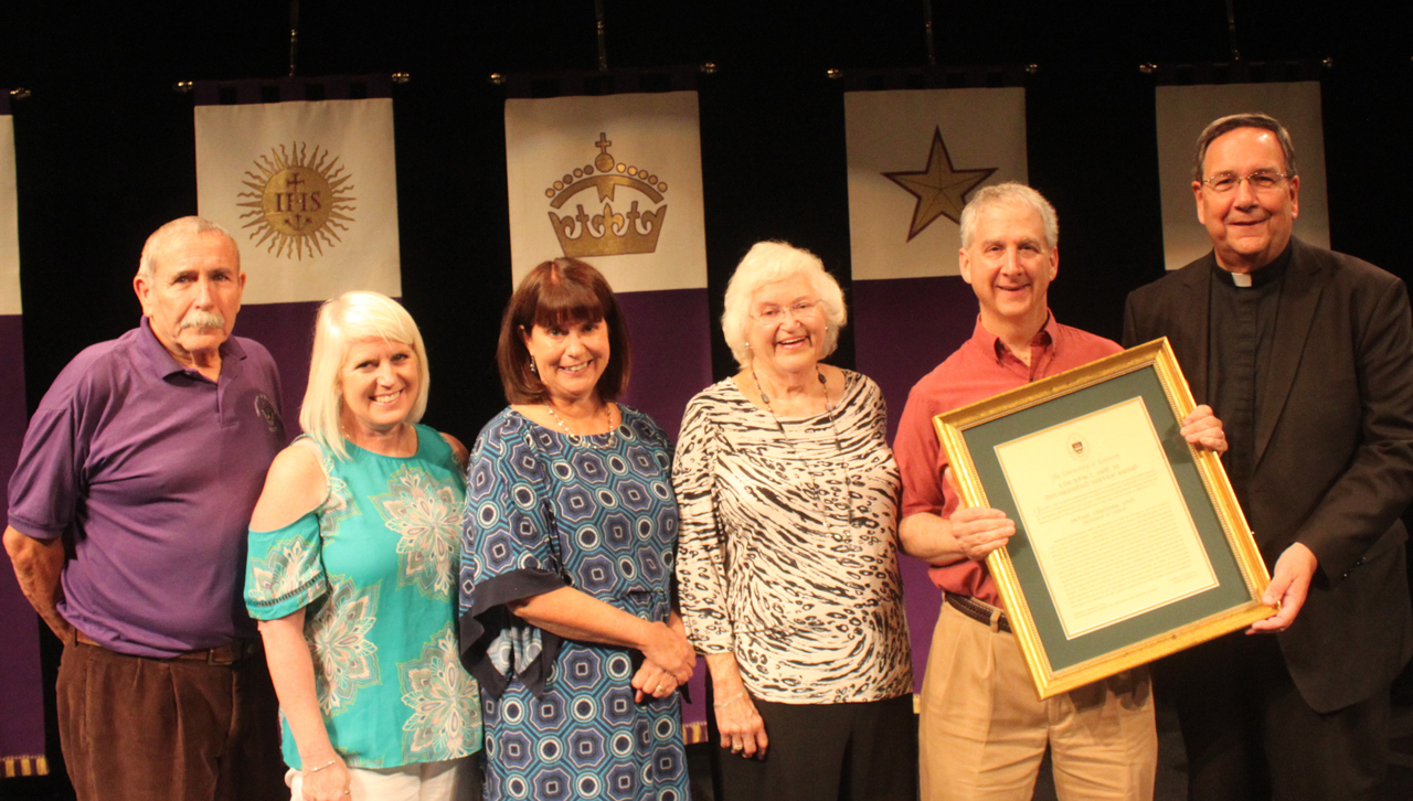 At the presentation of The University of Scranton’s John L. Earl III Award to Michael Friedman, Ph.D., professor of English and theatre, are, from left: Leonard Champney, Ph.D., professor emeritus; Jacqueline Earl Hurst and Karen Earl Kolon, M.D. ’85, daughters of the late John Earl; Pauline Earl, wife of the late John Earl; Dr. Freidman; and Rev. Herbert B. Keller, S.J., interim president at Scranton.