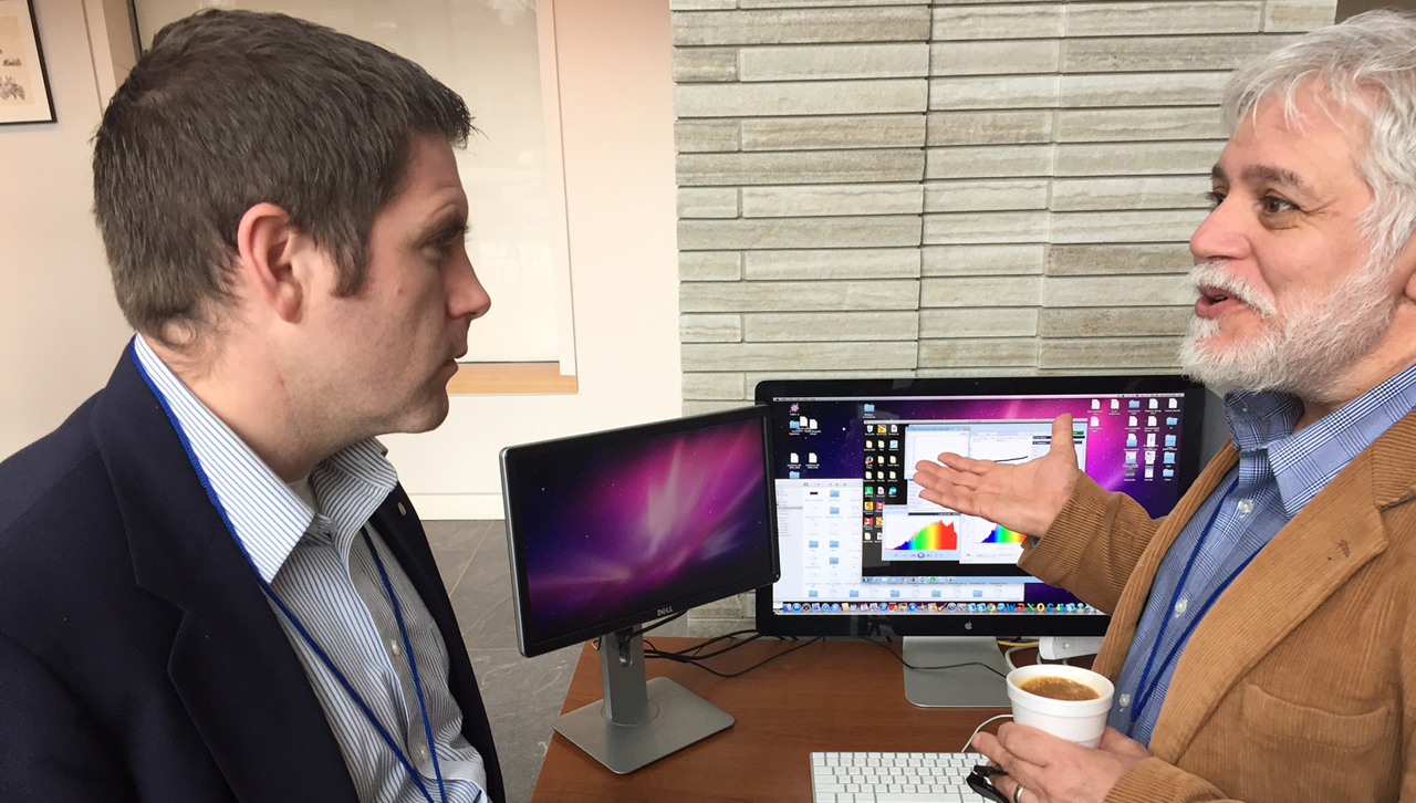 Dr. Robert A. Spalletta demonstrating live Radio Telescope data to Dr. Matthew Farrar.