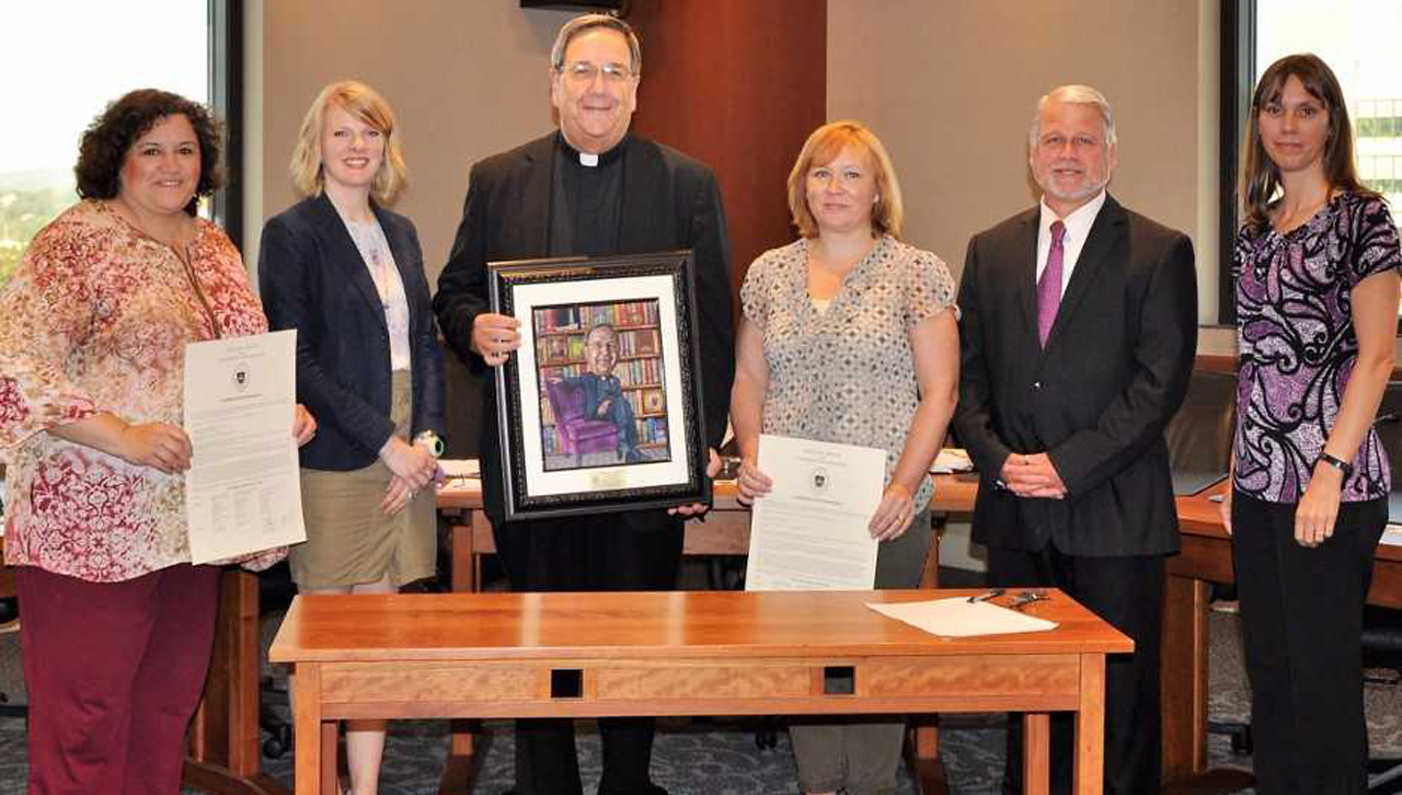 From left: Gina Butler, Amy Driscoll McNulty, Fr. Herbert Keller, S.J., Cynthia Tokash, Mark Murphy and Patricia Tetreault