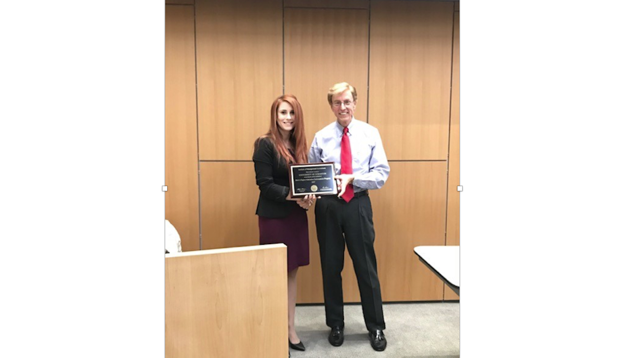 The University of Scranton’s undergraduate accounting program has earned endorsement by the Institute of Management Accountants (IMA). From left: Ashley Regan, faculty specialist and the University’s IMA student chapter faculty advisor and Harry W. Zike, chief financial officer of Chinook Sciences, member of the IMA Global Board of Directors and a 1976 graduate of the University.