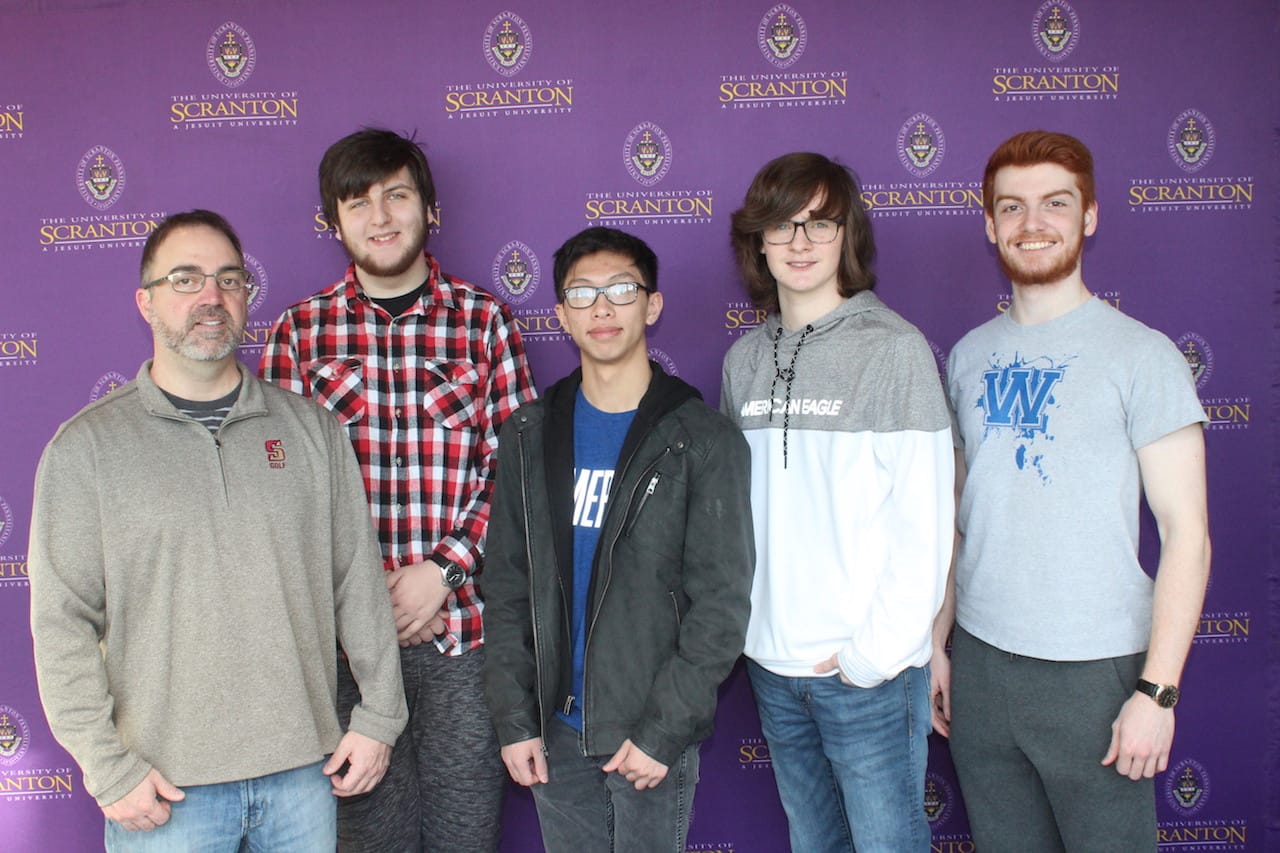 Scranton High School students participated in The University of Scranton’s annual Computer Programming Contest. From left: Coach Tony Battaglia; Scranton High students Benjamin Bektas, Jonathan Yudhistira and Jacob Thomas; and Sean McTiernan, Scranton, a sophomore at The University of Scranton majoring in computer science. 