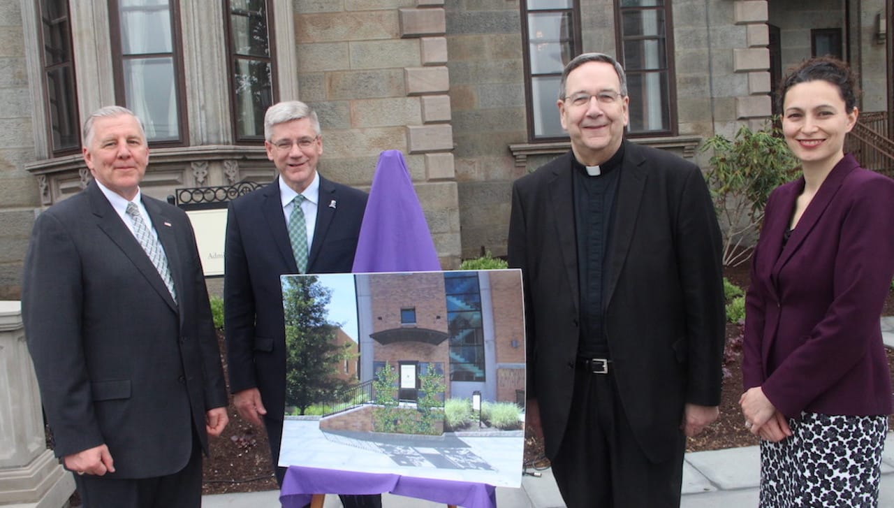 The University of Scranton held a ceremony on campus to celebrate pedestrian improvement projects on the Commons and Estate grounds recently completed. From left: Pennsylvania State Senator John Blake; Edward J. Steinmetz, senior vice president for finance and administration at the University; Rev. Herbert B. Keller, S.J., interim president of the University; and Julie Schumacher Cohen, director of community and government relations at the University.