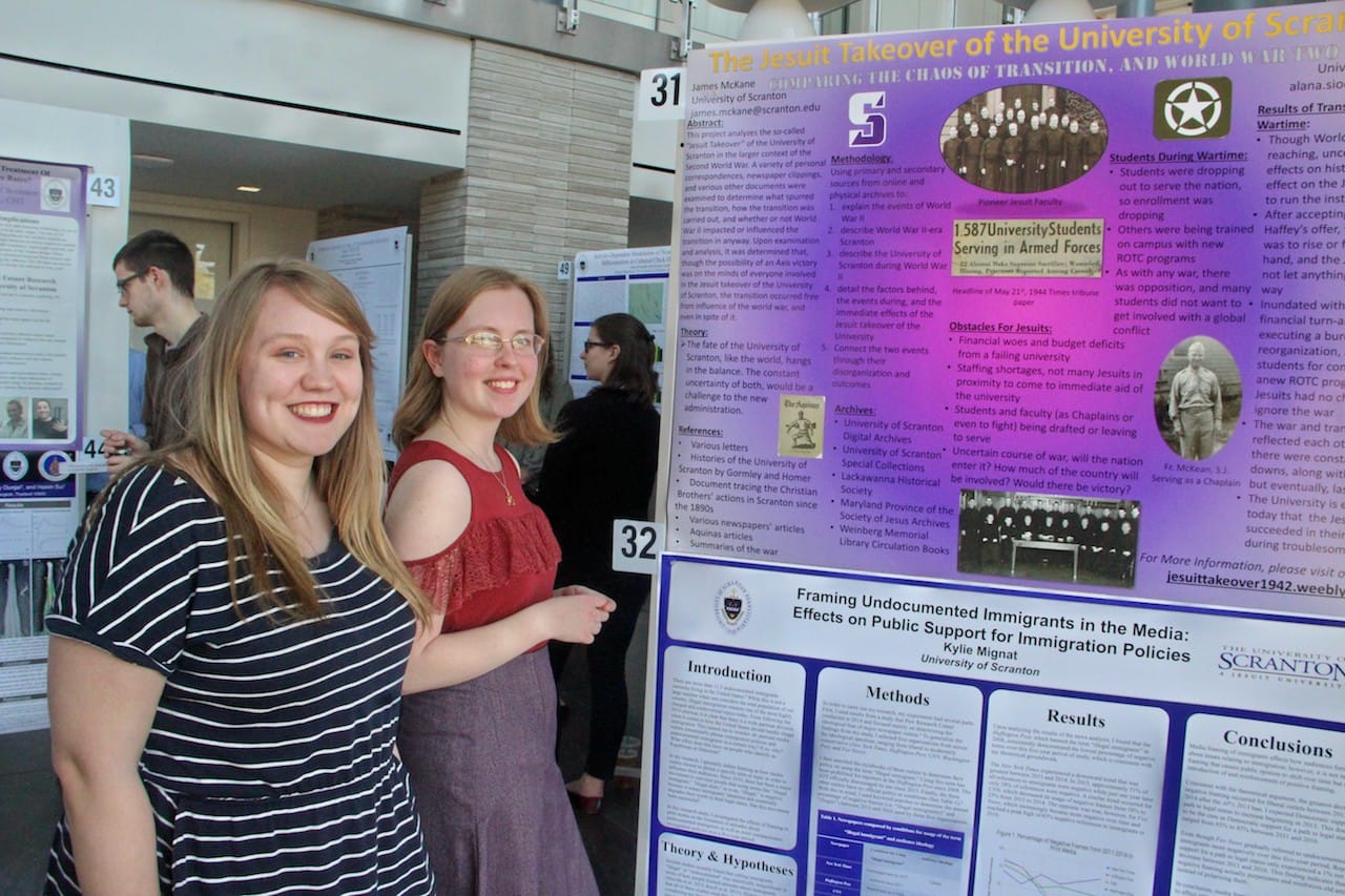 From left, Kylie Mignat, a triple major in international studies, German cultural studies and Hispanic studies from Canadensis, and Amanda Horner, a community health education major and philosophy double major and member of the University’s Special Jesuit Liberal Arts Honors Program from Buffalo, New York, were among the more than 175 students whose scholarly projects were presented at the University’s Celebration of Student Scholars.