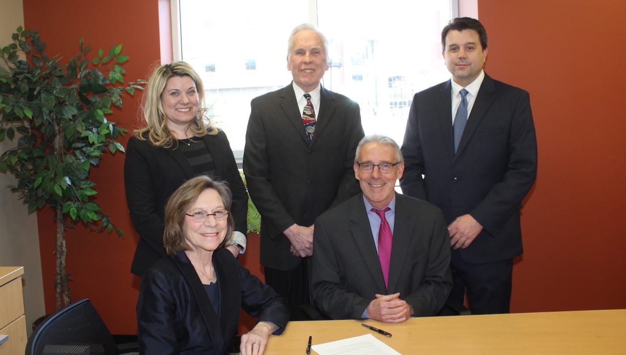 A new affiliation between The University of Scranton and Duquesne University School of Law will provide automatic admission and scholarship support to the law school for Scranton students whomeet program requirements. Seated from left: Maureen Lally-Green, J.D., dean, Duquesne University School of Law; and Brian Conniff, Ph.D., dean of The University of Scranton’s College of Arts and Sciences. Standing: Gina Cecchetti, associate director of admissions, Duquesne University School of Law; Matthew Meyer, Ph.D., pre-law advisor and associate professor of philosophy at Scranton; and Joseph Dreisbach, Ph.D., interim provost and senior vice president for academic affairs at Scranton.