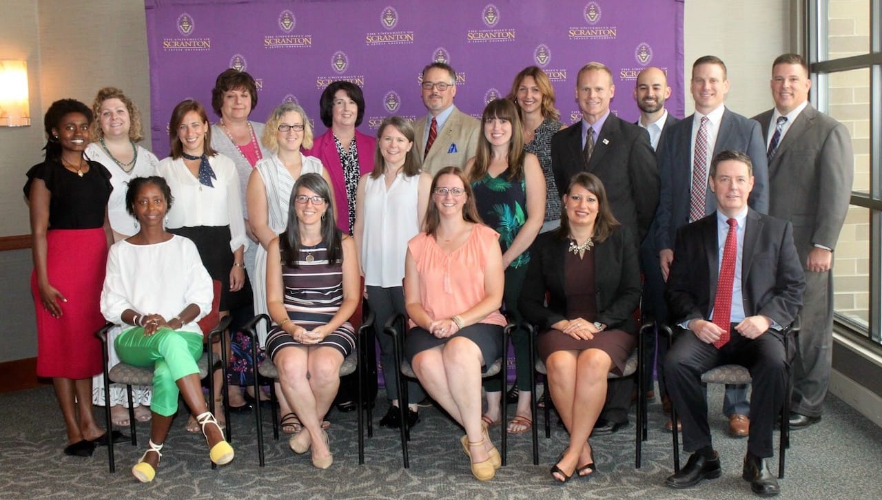 Members of the second cohort of students of The University of Scranton’s Nonprofit Leadership Certificate program were introduced to the program at a recent ceremony on campus. Seated, from left: Tonyehn Verkitus, Luzerne and Lackawanna Medical Societies; Athena Aardweg, NEPA Alliance; Kristen N. Follert, NEPA Community Health Care; Lauren Pluskey McLain, The Kirby Center; and Douglas Boyle, D.B.A., director of the Nonprofit Leadership Program at Scranton. Standing, from left: Angeline Abraham, Employment Opportunity Center; Katlyn J. Gardner, NEPA Community Health Care; Eloise Butovich, University of Scranton; Diane Dutko, The Luzerne Foundation; Gretchen Hunt Greaves, Commission on Economic Opportunity; Shannon Hayward, Maternal and Family Health Services, Inc.; Elizabeth Hughes, Earth Conservancy; David Falchek, American Wine Society; Janine Tomaszewski, Johnson College; April Kemp, Marley's Mission; Teddy Michel, Ignatian Volunteer Corps of NEPA; Todd Pousley, NeighborWorks NEPA; and Nonprofit Leadership Program faculty members Jesse Ergott and Kurt Bauman. Absent from photo were Joseph Salva, Individual Abilities in Motion; and Alison Woody, Geisinger Health Foundation.