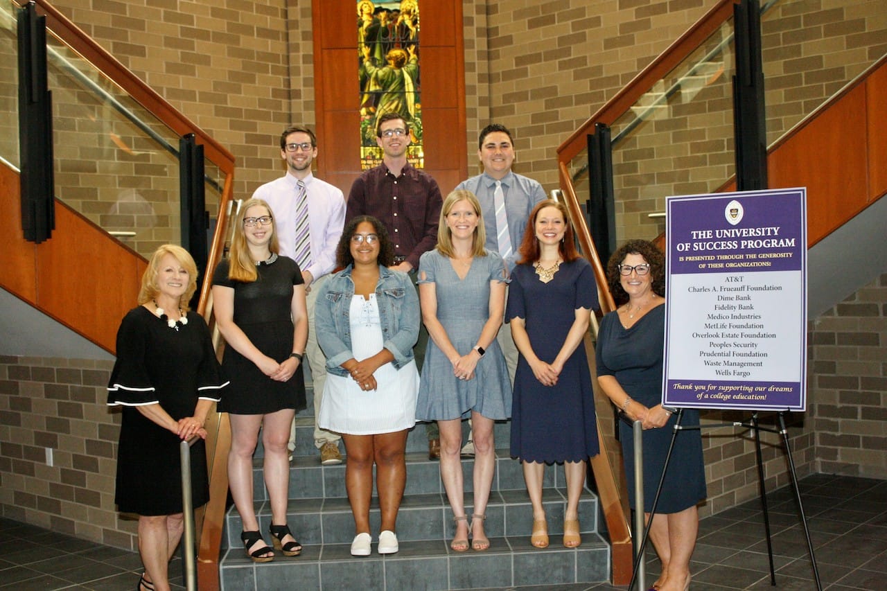 First row, from left: Margaret Loughney, University of Success program director; Brianna Lawrence, head counselor; Krystine Jimenez, counselor; Erin Shumbres, lead teacher; Kelly Judge, assistant teacher, and Andrea Mantione, D.N.P., director of the Leahy Community Health and Family Center.. Back row: Patrick Chapman, counselor; Joseph Stella, counselor, and Jacob McDonnell, assistant counselor.