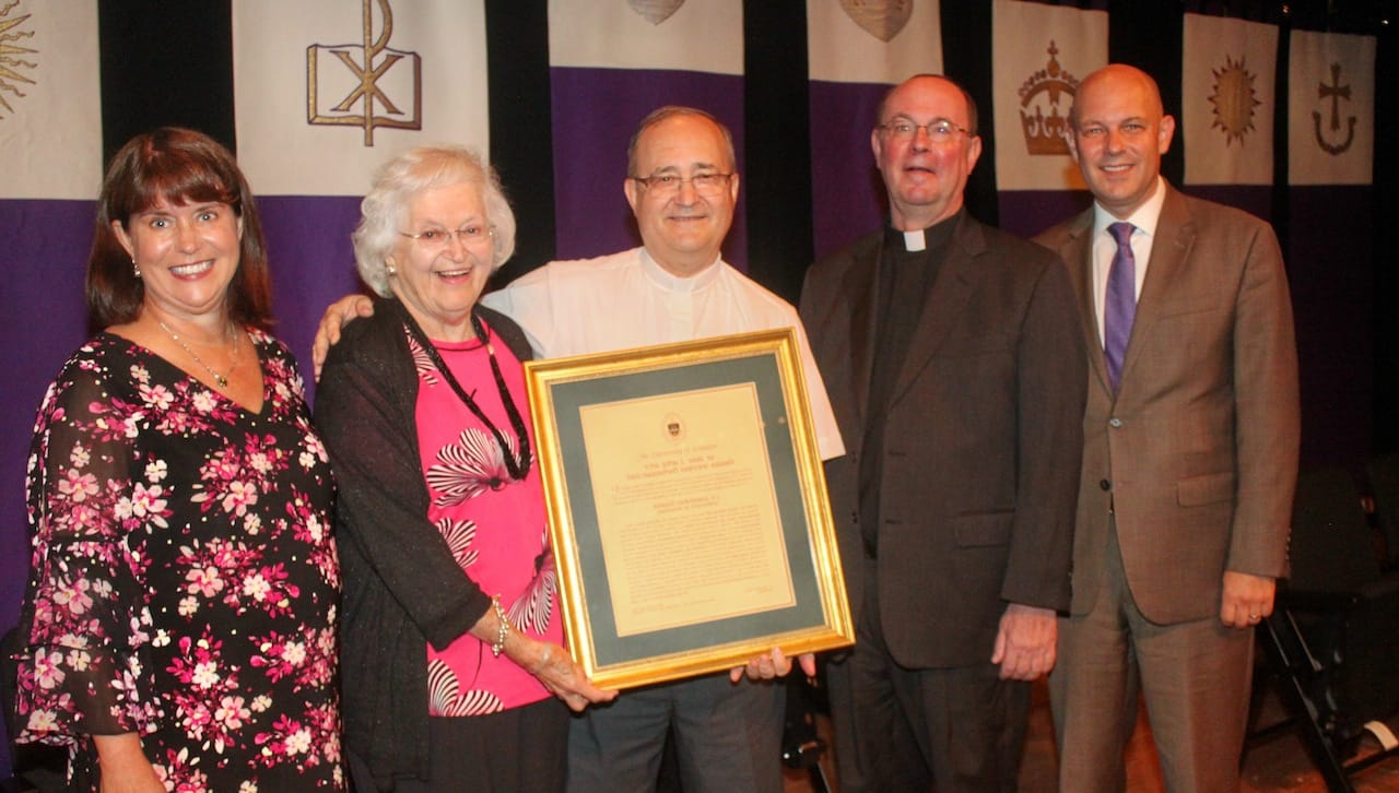 At the presentation of The University of Scranton’s John L. Earl III Award to Rev. Ronald McKinney, S.J., professor of philosophy, are, from left, Karen Earl Kolon, M.D. ’85, daughter of the late John Earl; Pauline Earl, wife of the late John Earl; Father McKinney; Rev. Scott R. Pilarz, S.J., president; and Jeff Gingerich, Ph.D., provost and senior vice president for academic affairs.