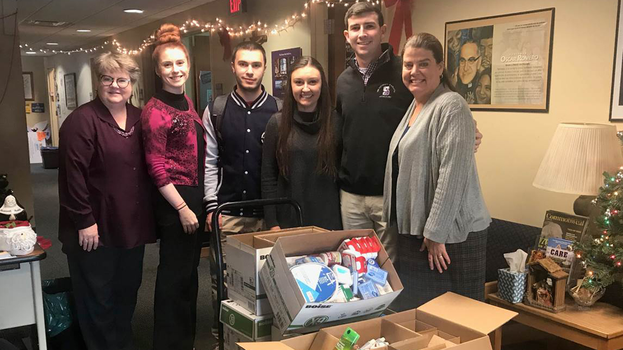 From left to right: Dr. Helen Wolf, Executive Director of Campus Ministries, Professor Ashley Stampone, Accounting Department, Nicholas Constantinou, Class of 2020, Nicole D’Alessandro, Class of 2018 and 2019 (MBA), Kyle Hayes, Class of 2019, and  Barbara King, Coordinator of the International Service Program. 