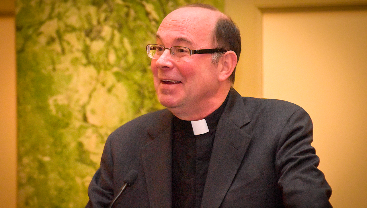 The Rev. Scott R. Pilarz, S.J., University President, addresses the crowd at the Washington, D.C., Presidential Christmas Reception Dec. 7.