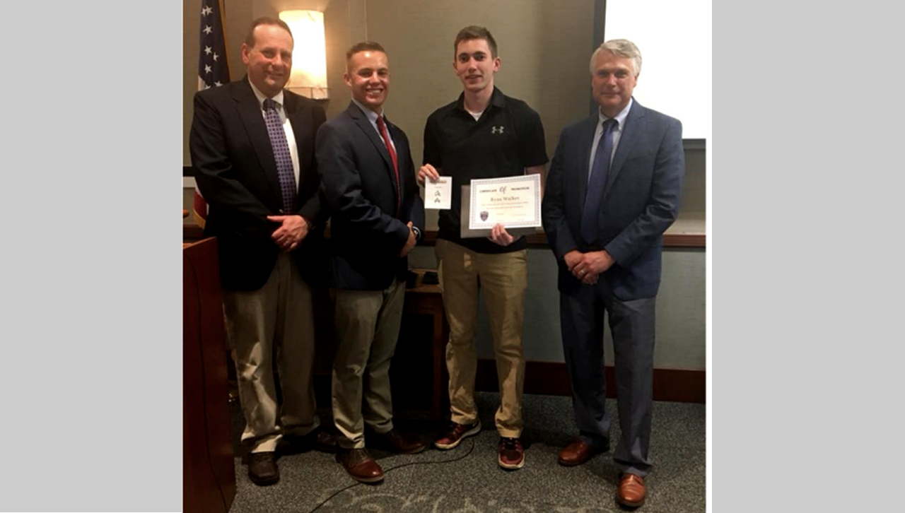 Walker receives his corporal promotion certificate.