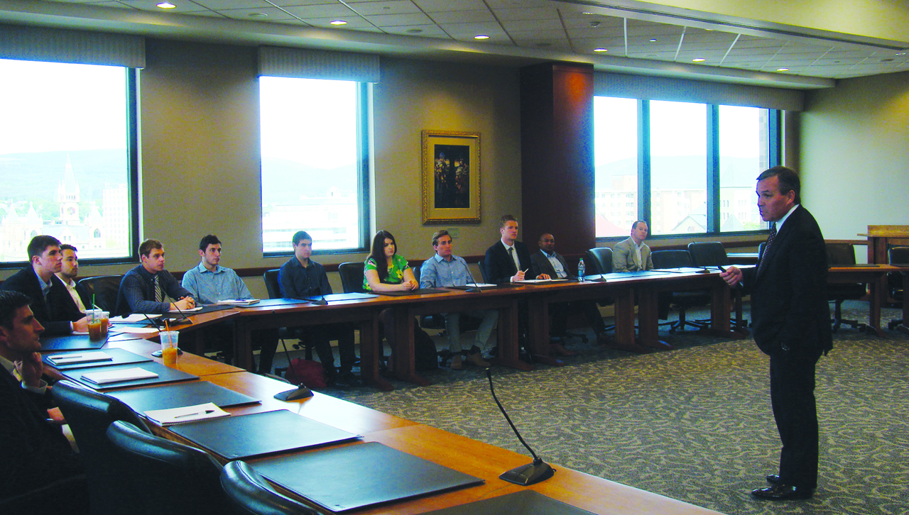 Executive in Residence John Dionne ’86, speaks to students in a Fixed Income Securities and Markets class.