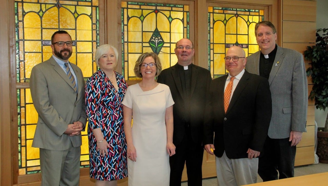 The University of Scranton presented its annual Pedro Arrupe, S.J., Award for Distinguished Contributions to Ignatian Mission and Ministry to alumna Kathleen Sprows Cummings, Ph.D., ’93, ’G93, the director of the Cushwa Center for the Study of American Catholicism at the University of Notre Dame, at a ceremony on campus April 11.From left: Ryan Sheehan, J.D., assistant director of The Jesuit Center; Cathy Seymour, campus minister for social justice; Dr. Cummings; Rev. Scott R. Pilarz, S.J., president of The University of Scranton; Roy Domenico, Ph.D., professor of history; and Rev. Patrick Rogers, S.J., executive director of The Jesuit Center.