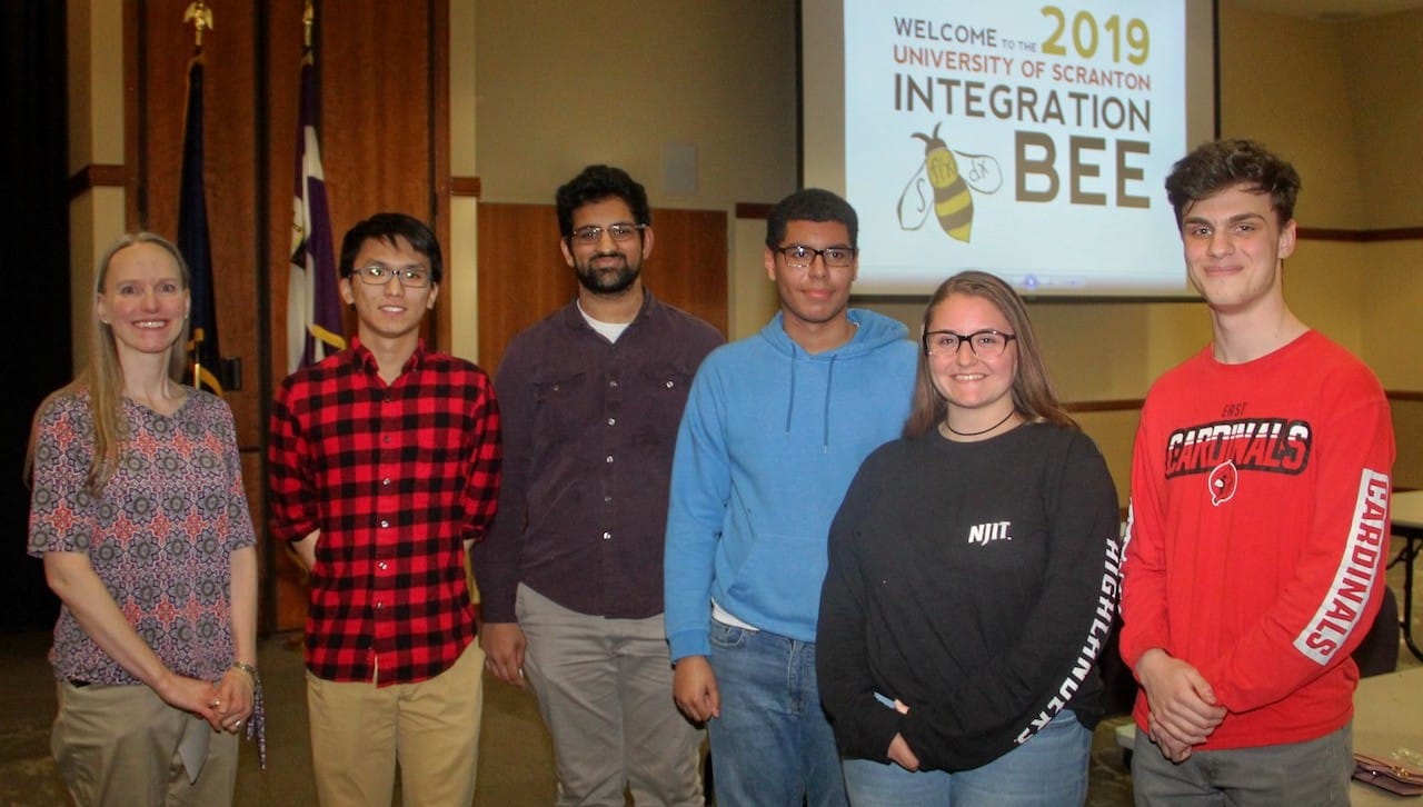 Five area high school students were the finalists in The University of Scranton’s 2019 Math Integration Bee held on campus in April. From left are: Stacey Muir, Ph.D., professor of mathematics at The University of Scranton; and finalists Andy Yin, Wyoming Seminary Preparatory School; Vishnu Dasari, Central Columbia High School, who won the competition; Jefferson Casado, Hazleton Area Academy of Sciences; Haylee Merloa, Hazleton Area Academy of Sciences; and Alexander Lindenbaum, Pocono Mountain East High School.