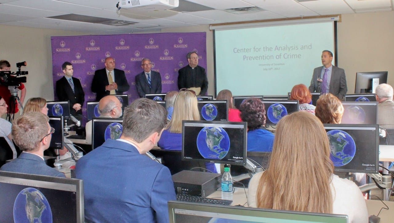 The University of Scranton Center for the Analysis and Prevention of Crime was one of just 16 organizations in the nation to be awarded a grant through the Vera Institute of Justice’s In Our Backyards Community Grants for 2019. The grant will support the Center’s data-sharing, analysis and dissemination plan with the Lackawanna County Prison and other community partners. In the photo, Michael Jenkins, Ph.D., executive director of the Center for the Analysis and Prevention of Crime, speaks at the Center’s opening in 2017.