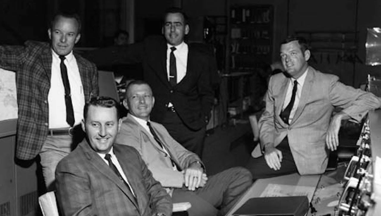 University of Scranton alumnus Glynn S. Lunney, far right, served as a NASA flight director for the Apollo 11 mission that placed the first man on the moon fifty years ago. Lunney completed his studies at Scranton in 1955 and received an honorary degree from the University in 1971. He is pictured with Apollo 11 flight directors in the Mission Control Center, seated from left, Clifford E. Charlesworth and Gerald D. Griffin; standing, Eugene F. Kranz and Milton L. Windler; and Lunney, far right. 